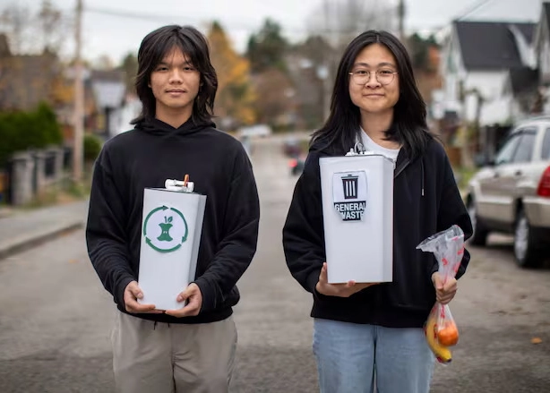 Sunny Huynh, left, and Amy Bach with their invention Bin Genius, pictured in Vancouver (courtesy Ben Nelms/CBC News)