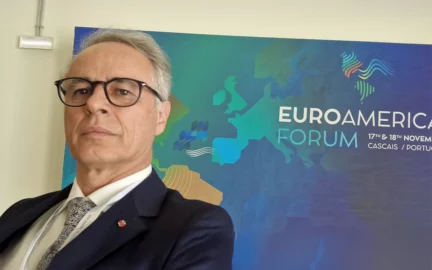 Francesco Berrettini Director, Partnerships & Project in Portugal poses in front of the EUROAMERICA'S banner